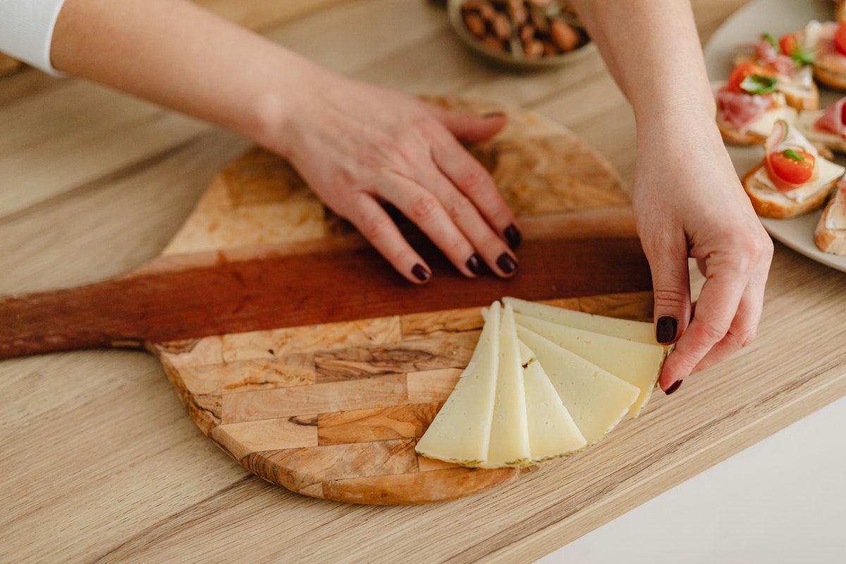 woman preparing a charcuterie board